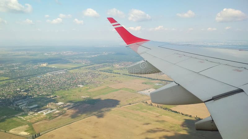 Earth from a height, view from an airplane window: cities and fields. Airplane height stock images, royalty-free photos and pictures