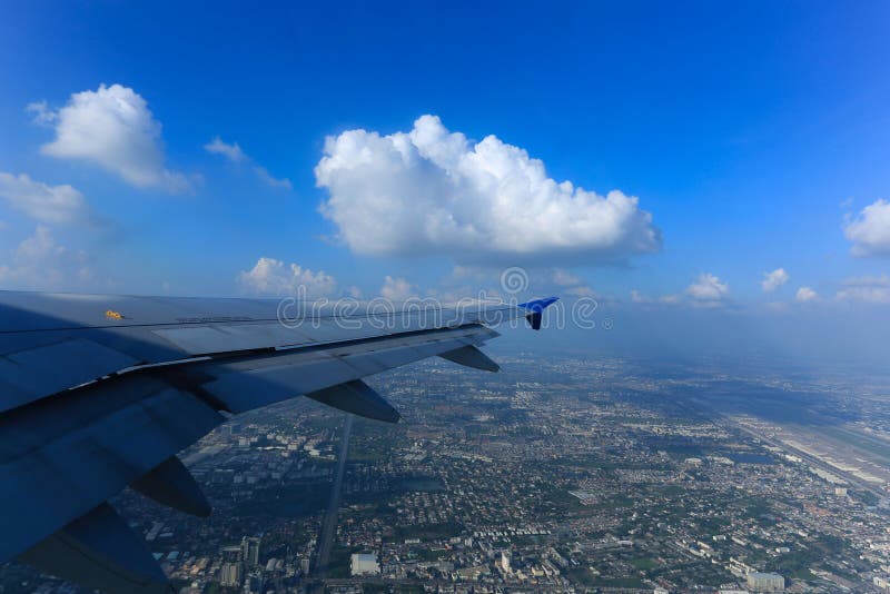 airplane wing flying in the blue sky