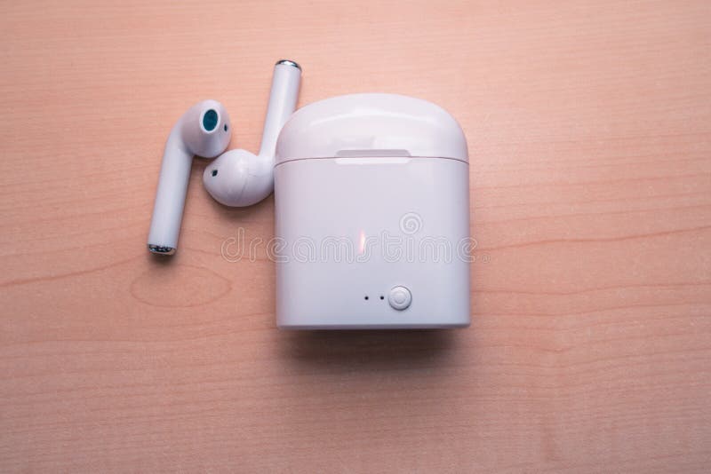 Airpods with the case are on the desk