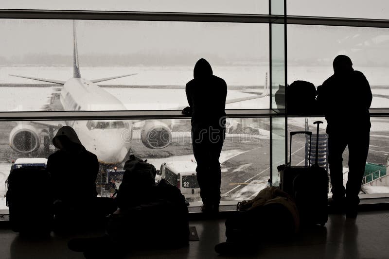 Airport closed, flights cancelled. Flights cancelled, disappointed passengers awaiting the chance to fly home stock images Airport closed, flights cancelled. Flights cancelled, disappointed passengers awaiting the chance to fly home stock images