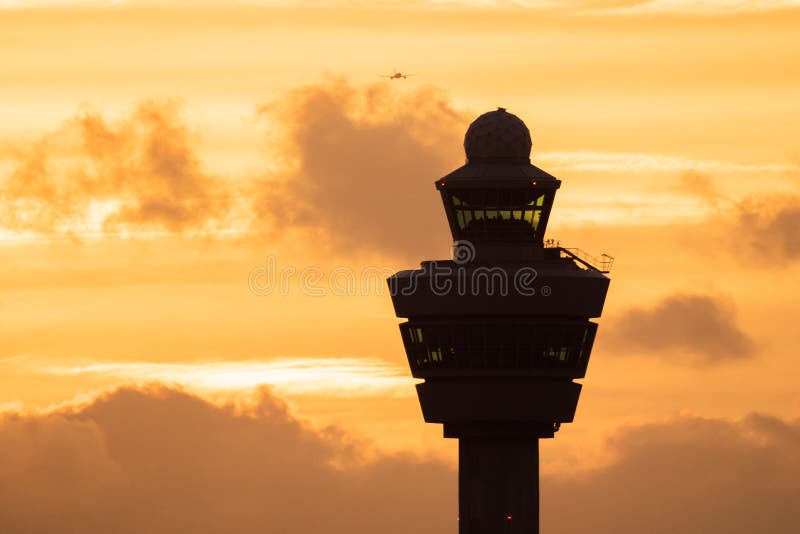 Airport control tower sunset plane