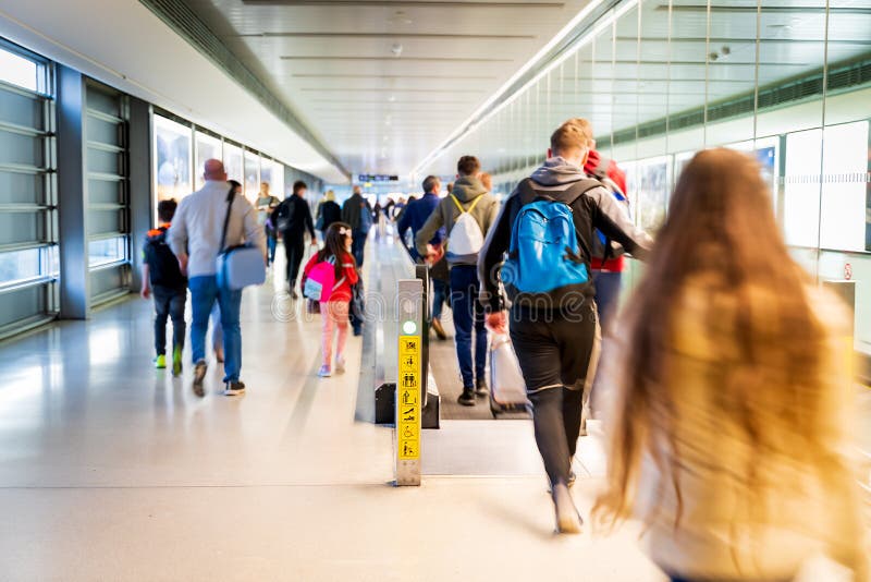 Airport, people rushing for their flights, Dublin. Airport, people rushing for their flights, long corridor with moving walkway, motion blur, Dublin stock photos Airport, people rushing for their flights, Dublin. Airport, people rushing for their flights, long corridor with moving walkway, motion blur, Dublin stock photos
