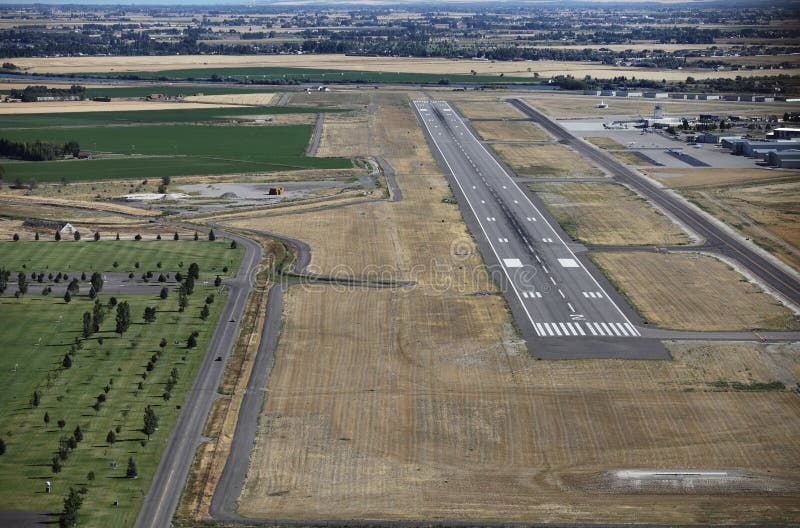 The runway and taxiway at a small city airport.