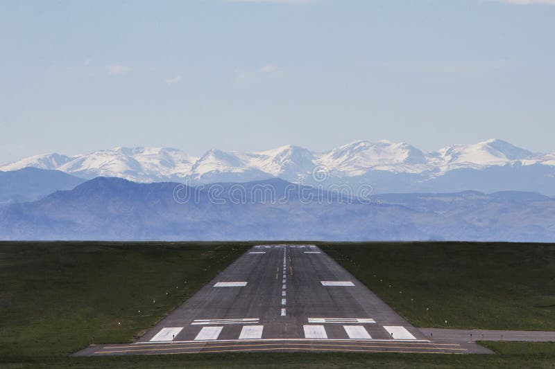 Airport runway with mountains stock images