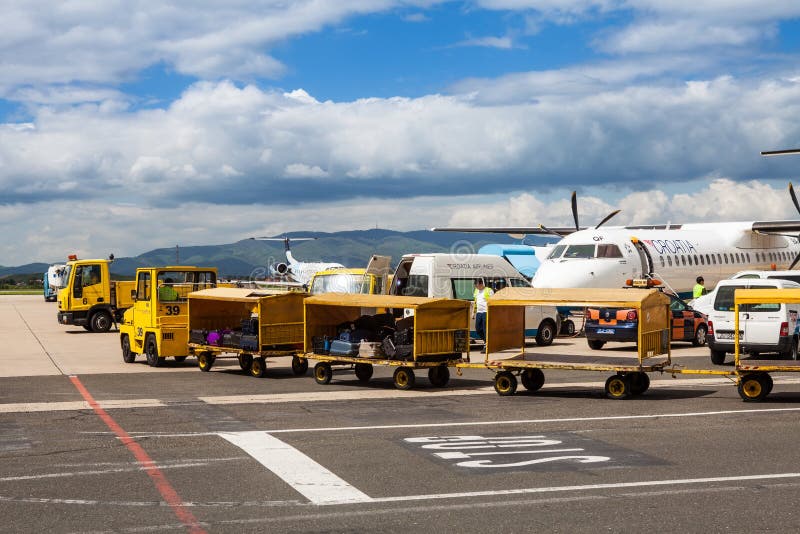Airport trucks handling baggage at Zagreb Airport