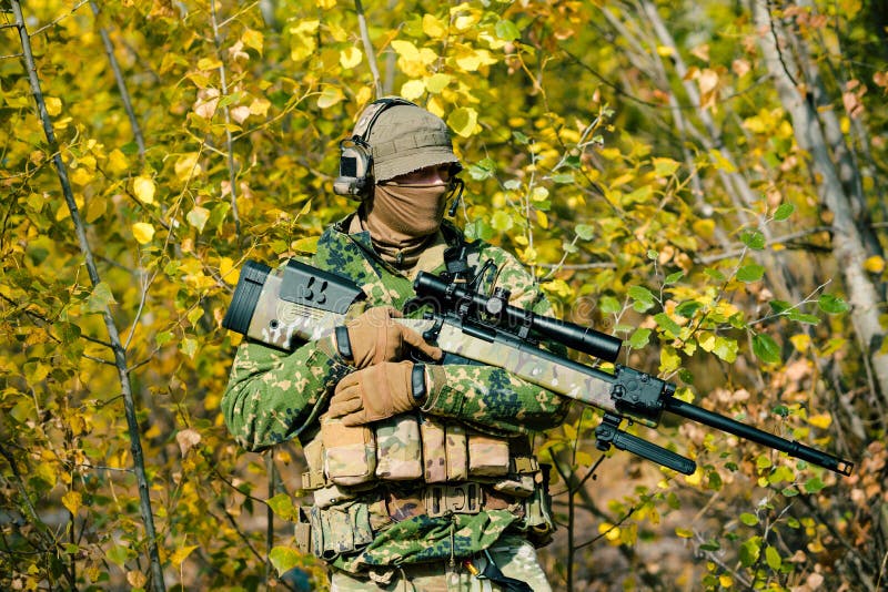 Airsoft Man in Uniform Hold Sniper Rifle on Yellow Forest Backdrop