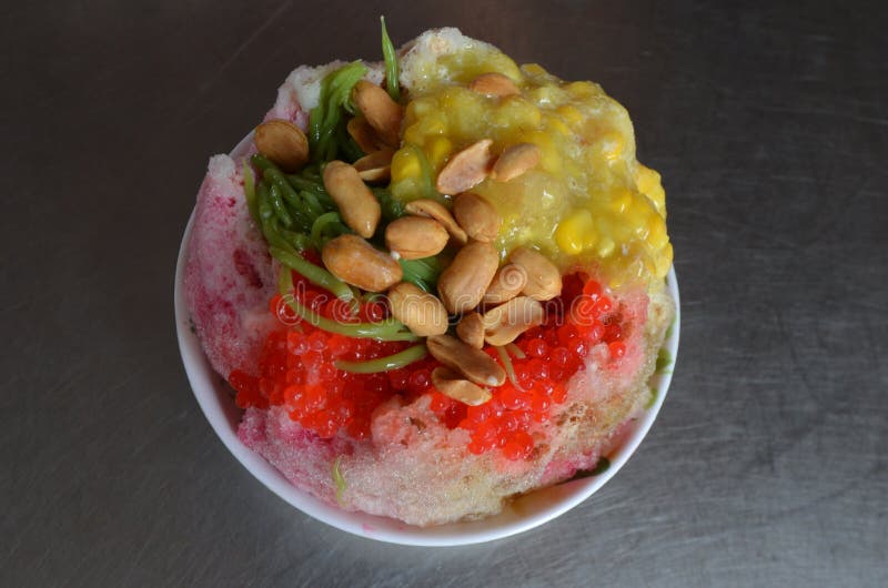 Ais kacang, literally meaning `bean ice`, also commonly known as ABC, is a Malaysian dessert which is also common in Singapore and Brunei. Traditionally, an ice shaving machine is used to churn out the shaved ice used in the dessert, originally hand cranked but now more often motorised. Ais kacang, literally meaning `bean ice`, also commonly known as ABC, is a Malaysian dessert which is also common in Singapore and Brunei. Traditionally, an ice shaving machine is used to churn out the shaved ice used in the dessert, originally hand cranked but now more often motorised.