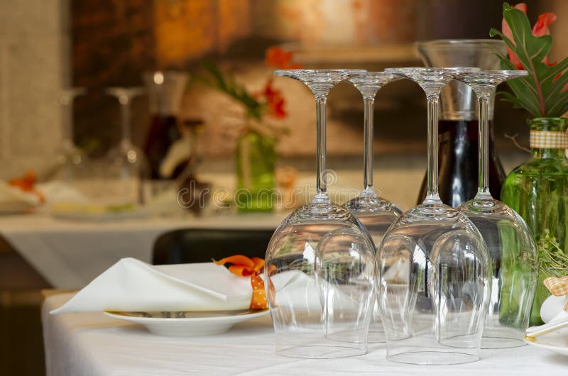 Details of a table place setting with glasses at a fine dining restaurant. Details of a table place setting with glasses at a fine dining restaurant.