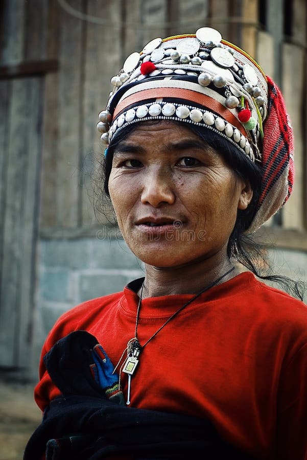 akha woman in front t of her home in the northern part of the country stock photo akha woman in front t of her home in the northern part of the country stock photo