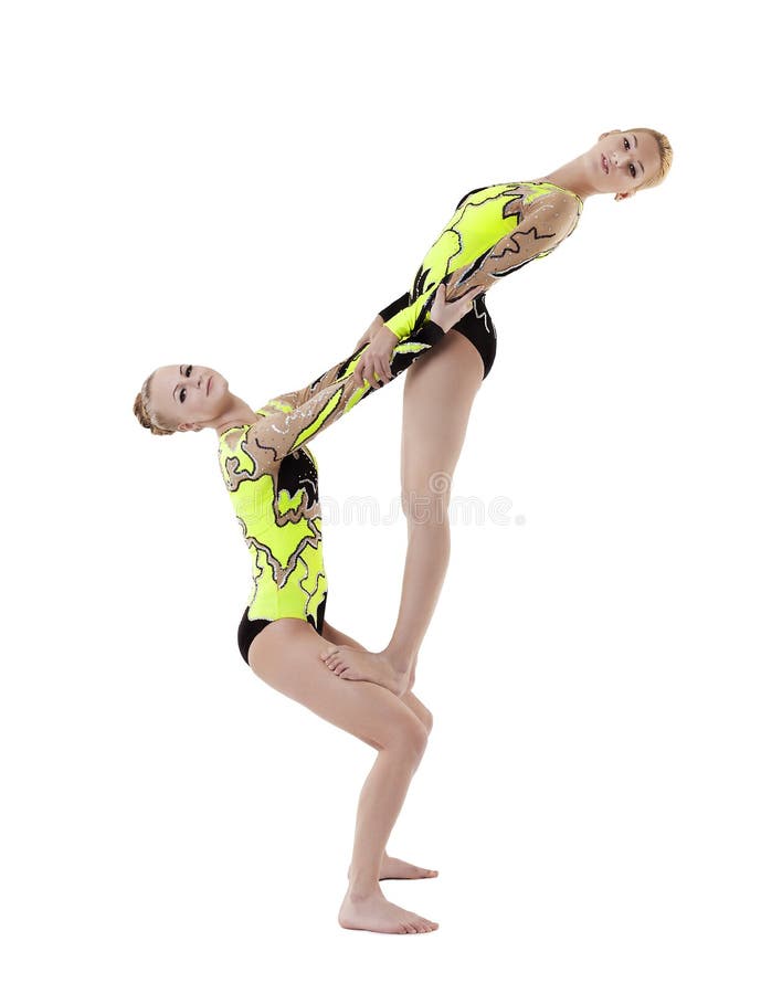 Two young acrobats dance in free program isolated. Two young acrobats dance in free program isolated
