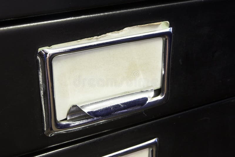 Close-up of a black mini filing cabinet and label. Close-up of a black mini filing cabinet and label