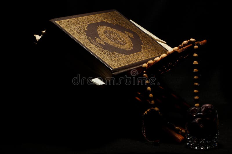 The Al-Quran on the Koran Holds a Stand with a Dark Background ...