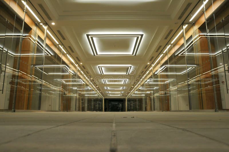 Low Angle View of a Walkway in an Empty Shopping Mall. Low Angle View of a Walkway in an Empty Shopping Mall