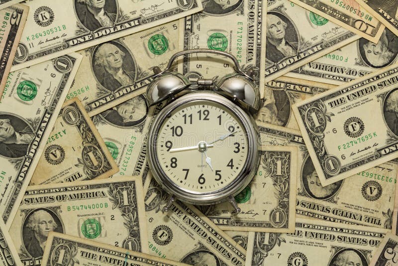 Alarm Clock on Carpet of Dollar Bills, Time is Money Stock Photo Image of investing, hour