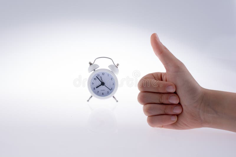 Alarm clock in hand stock photo. Image of minute, hour 121903092