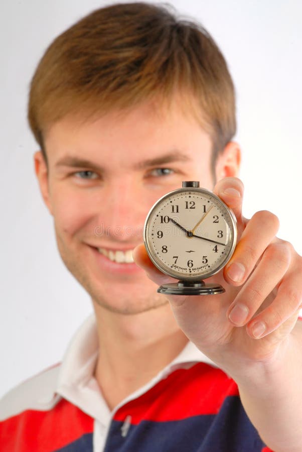 Alarm clock in hands