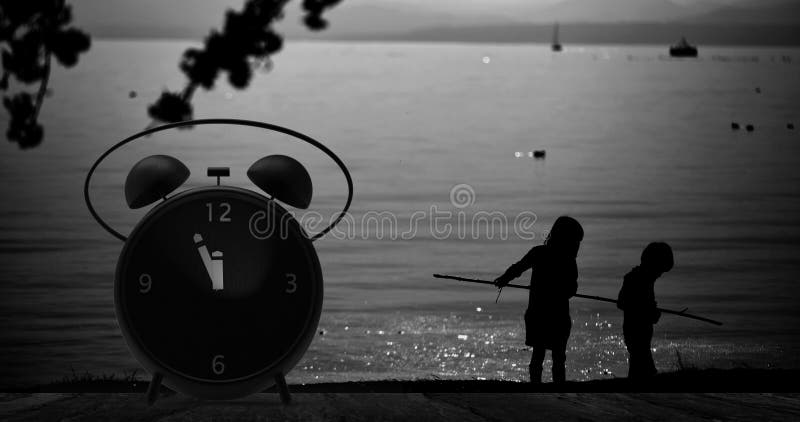 Alarm clock with little minutes to twelve o`clock stock photo