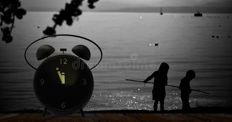 Alarm clock with little minutes to twelve o`clock stock photos