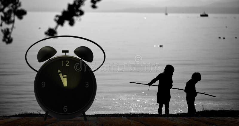 Alarm clock with little minutes to twelve o`clock stock image