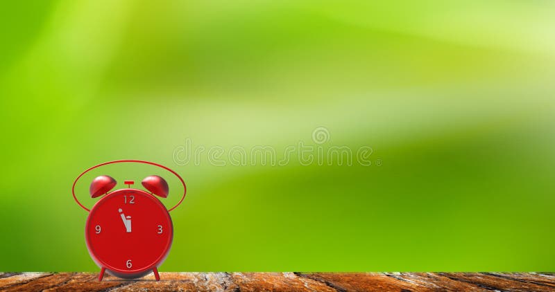 Alarm clock with little minutes to twelve o`clock royalty free stock images