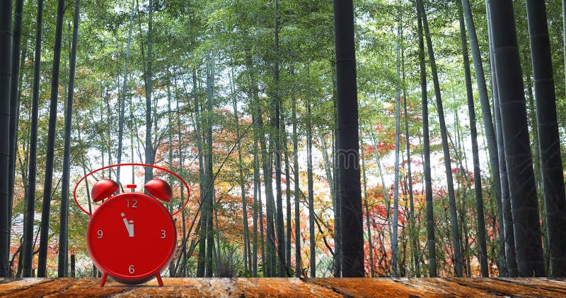 The alarm clock with little minutes to twelve o`clock