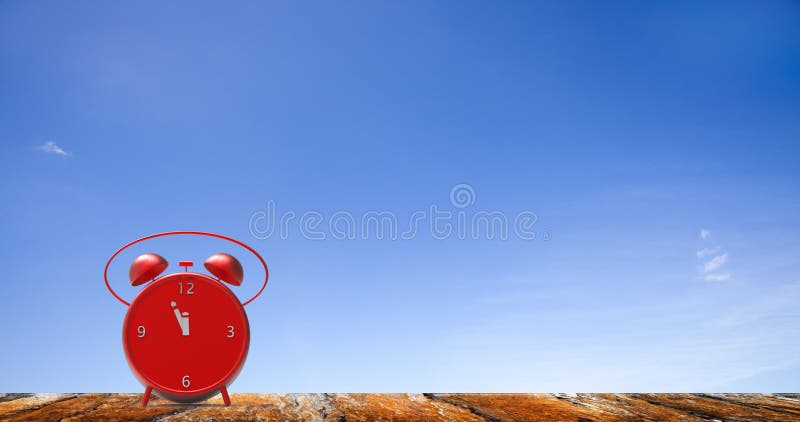Alarm clock with little minutes to twelve o`clock royalty free stock image