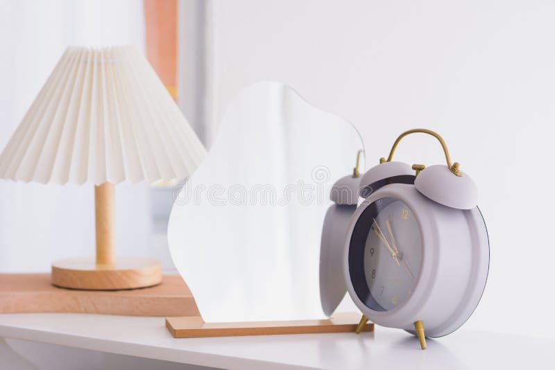Alarm Clock and Mirror on Natural Light Stock Photo Image of object