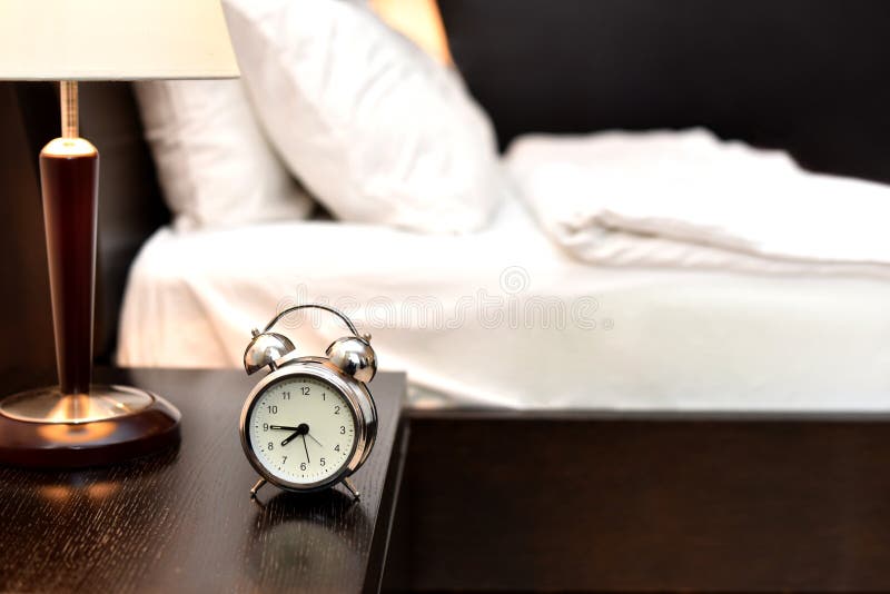 Alarm Clock Next To Bed In Bedroom Without People 7:45 Pm Or Am. Morning,  Reminder. Time Concept Stock Photo - Image Of Countdown, Clock: 217083956