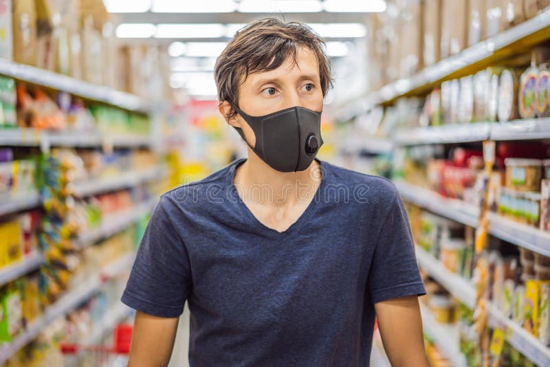 Shopper Wearing Face Mask Walks Past Editorial Stock Photo - Stock