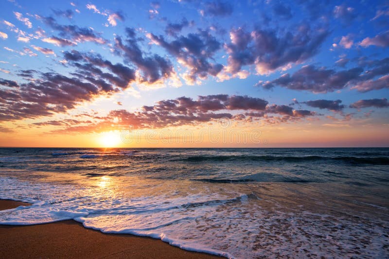 Brilliant ocean beach sunrise. Dramatic sky. Sunrise shot. Brilliant ocean beach sunrise. Dramatic sky. Sunrise shot