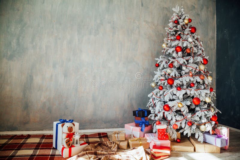 Christmas snowy Christmas tree with presents in a white room in winter 1. Christmas snowy Christmas tree with presents in a white room in winter 1