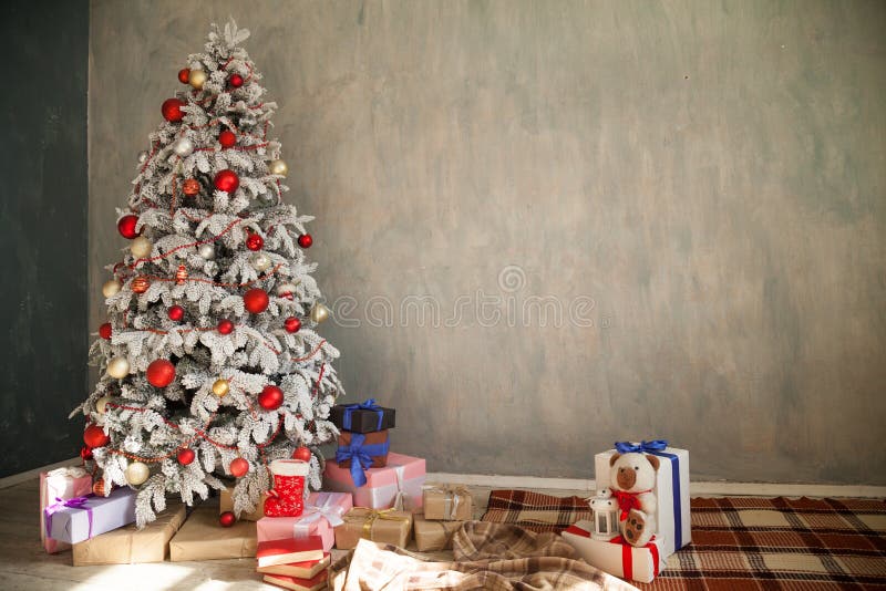 Christmas snowy Christmas tree with presents in a white room in winter 1. Christmas snowy Christmas tree with presents in a white room in winter 1