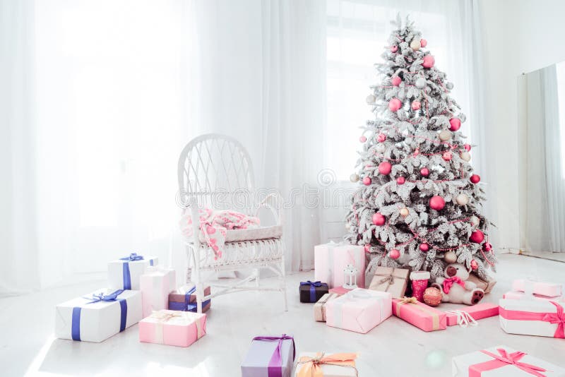 Christmas snowy Christmas tree with presents in a white room in winter 1. Christmas snowy Christmas tree with presents in a white room in winter 1