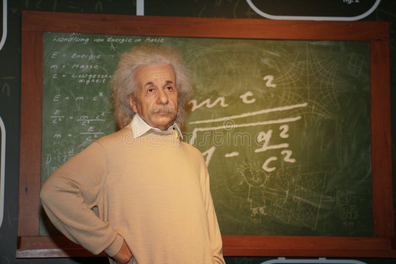 Albert Einstein wax model standing at blackboard.