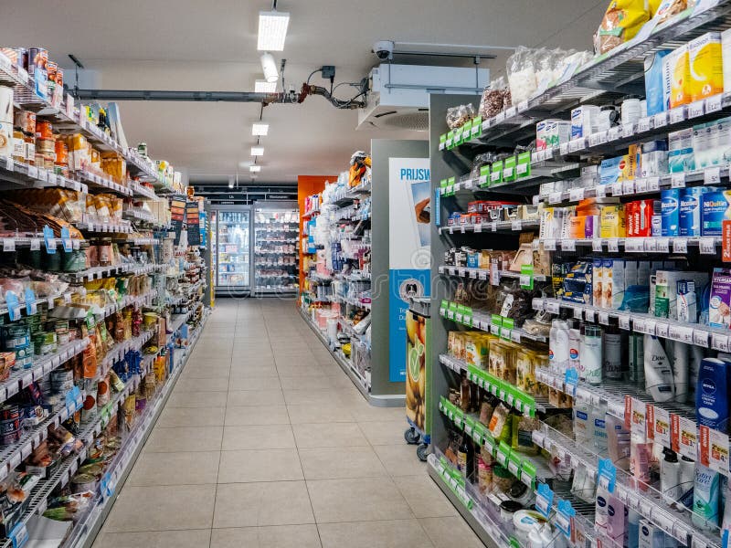 Haarlem, Netherlands - Aug 29, 2019: Large interior of Albert Heijn store supermarket with rows cosmetics and preserves products. AH is the biggest supermarket business in the Netherlands.