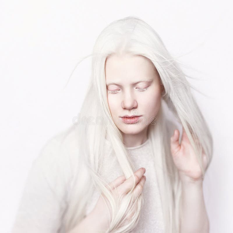 Albino female with white skin and white long hair. Photo face. Portrait of the head. Blonde girl. Wind. Albino female with white skin and white long hair. Photo face. Portrait of the head. Blonde girl. Wind