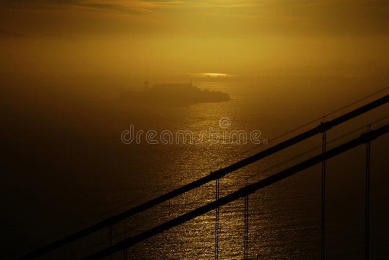 The Alcatraz island in the sunrise seen from the distance. The Alcatraz island in the sunrise seen from the distance.