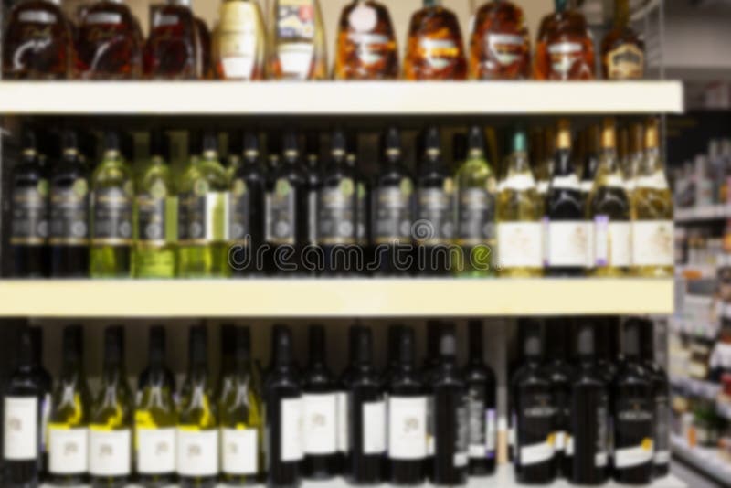 Alcohol Bottles on the Shelves in the Store. Front View Stock Image