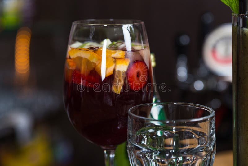 Mix alcohol cocktail in glass on bar for party