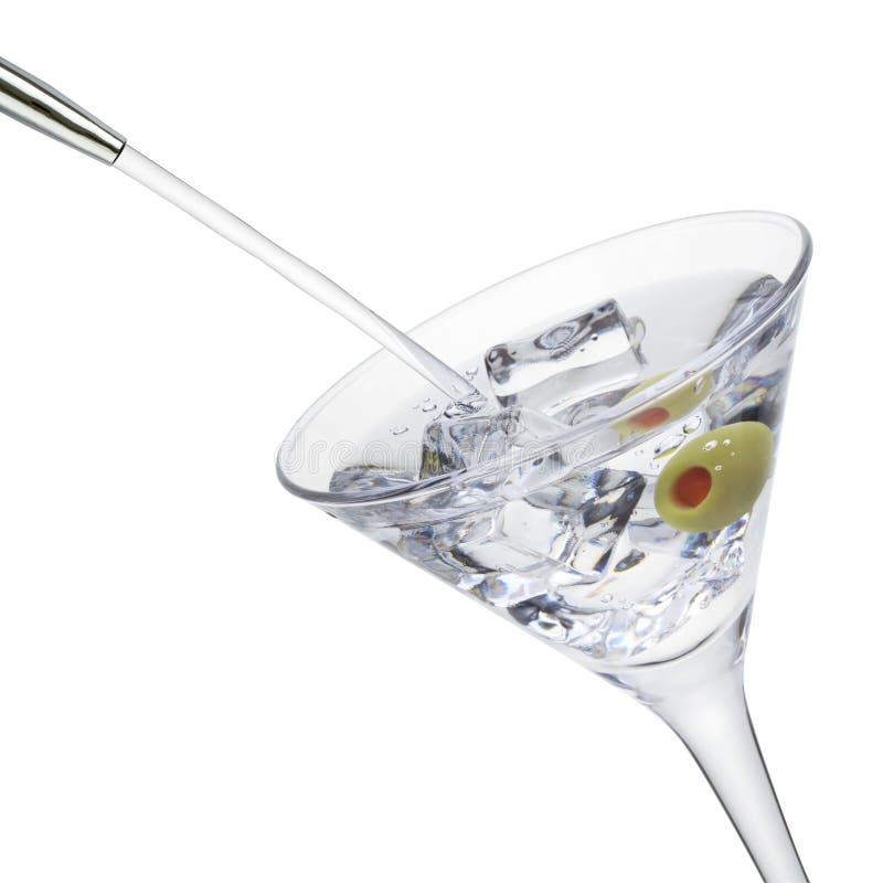 Alcohol pouring into a martini glass with olive and ice cubes, isolated on the white background, clipping path included. Alcohol pouring into a martini glass with olive and ice cubes, isolated on the white background, clipping path included.