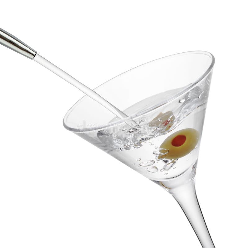 Alcohol pouring into a martini glass with olive, isolated on the white background, clipping path included. Alcohol pouring into a martini glass with olive, isolated on the white background, clipping path included.