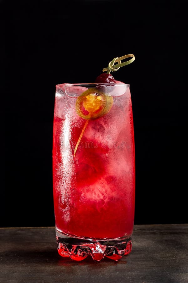 Alcoholic Cocktail with Cherries. Cherry in Transparent Glass Beaker