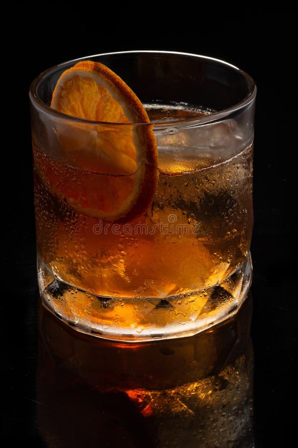 Alcoholic Cocktail Old Fashioned Cocktail with Orange Slice and Lump