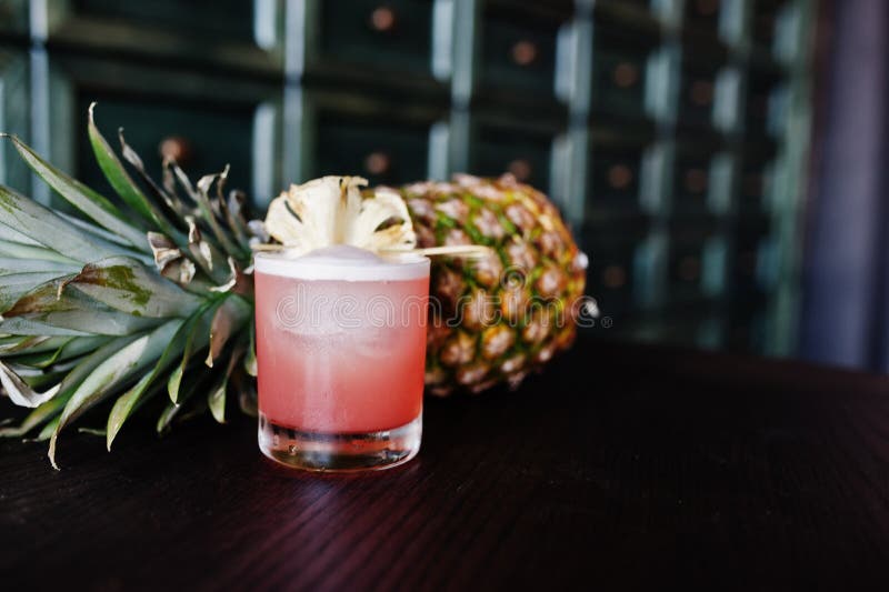 Alcoholic Cocktail with Pineapple at Bar Table. Stock Photo Image of