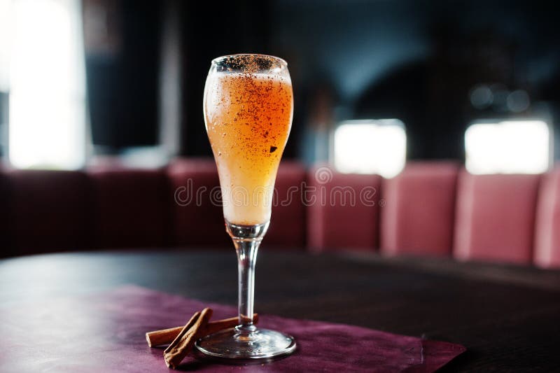 Alcoholic Long Cocktail with Cinnamon at Bar Table. Stock Photo Image