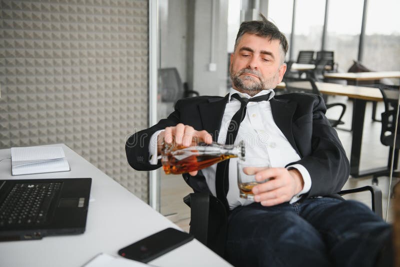 Alcoholism at Work. Tired Employee Drinking Alcohol at Workplace, Can