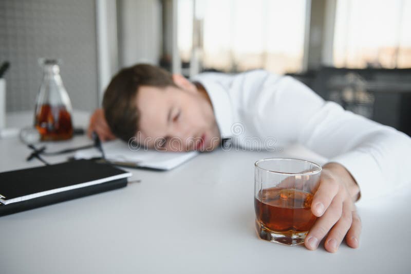 Alcoholism at Work. Tired Employee Drinking Alcohol at Workplace, Can