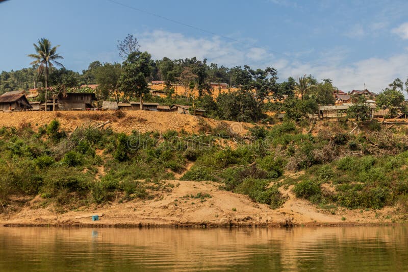 Village above waters of Nam Ou 3 reservoir, Laos. Village above waters of Nam Ou 3 reservoir, Laos