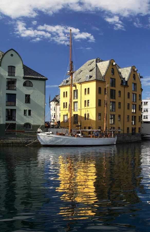 Great boat and house reflected in the sea water - Alesund, Norway. Great boat and house reflected in the sea water - Alesund, Norway