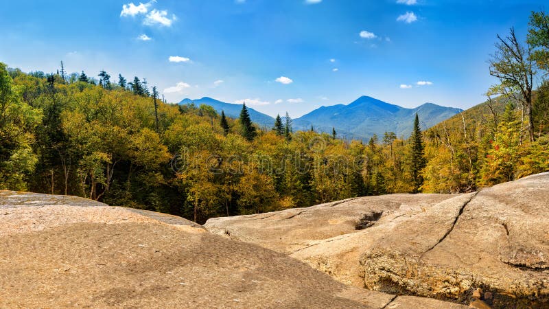 Algonquin Peak as viewed from Indian Falls along Mt Marcy hiking trail. Algonquin Peak is the second highest mountain in New York, and one of the 46 Adirondack High Peaks in Adirondack Park. Algonquin Peak as viewed from Indian Falls along Mt Marcy hiking trail. Algonquin Peak is the second highest mountain in New York, and one of the 46 Adirondack High Peaks in Adirondack Park